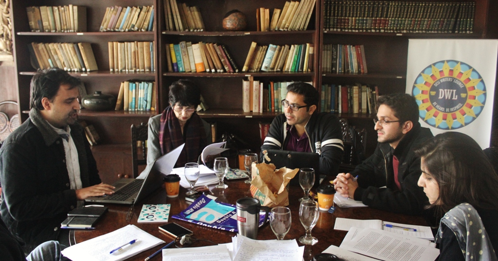 Bilal Shadani speaks as participants and instructor Usman T. Malik (centre) listen during the Sunday session of The Rising Dust speculative fiction workshop in Lahore.